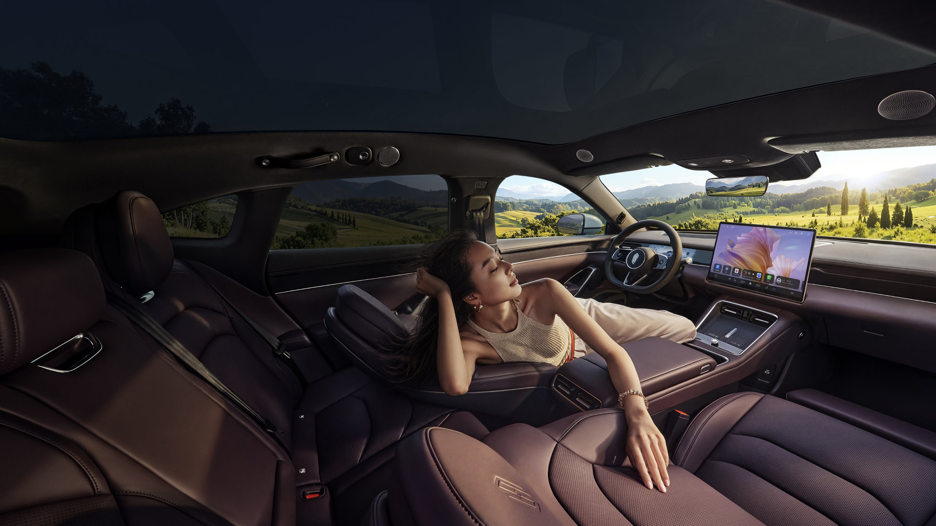 A user reclining in the Shangjie Z7-Z7T cabin, showing the car's spacious interior.