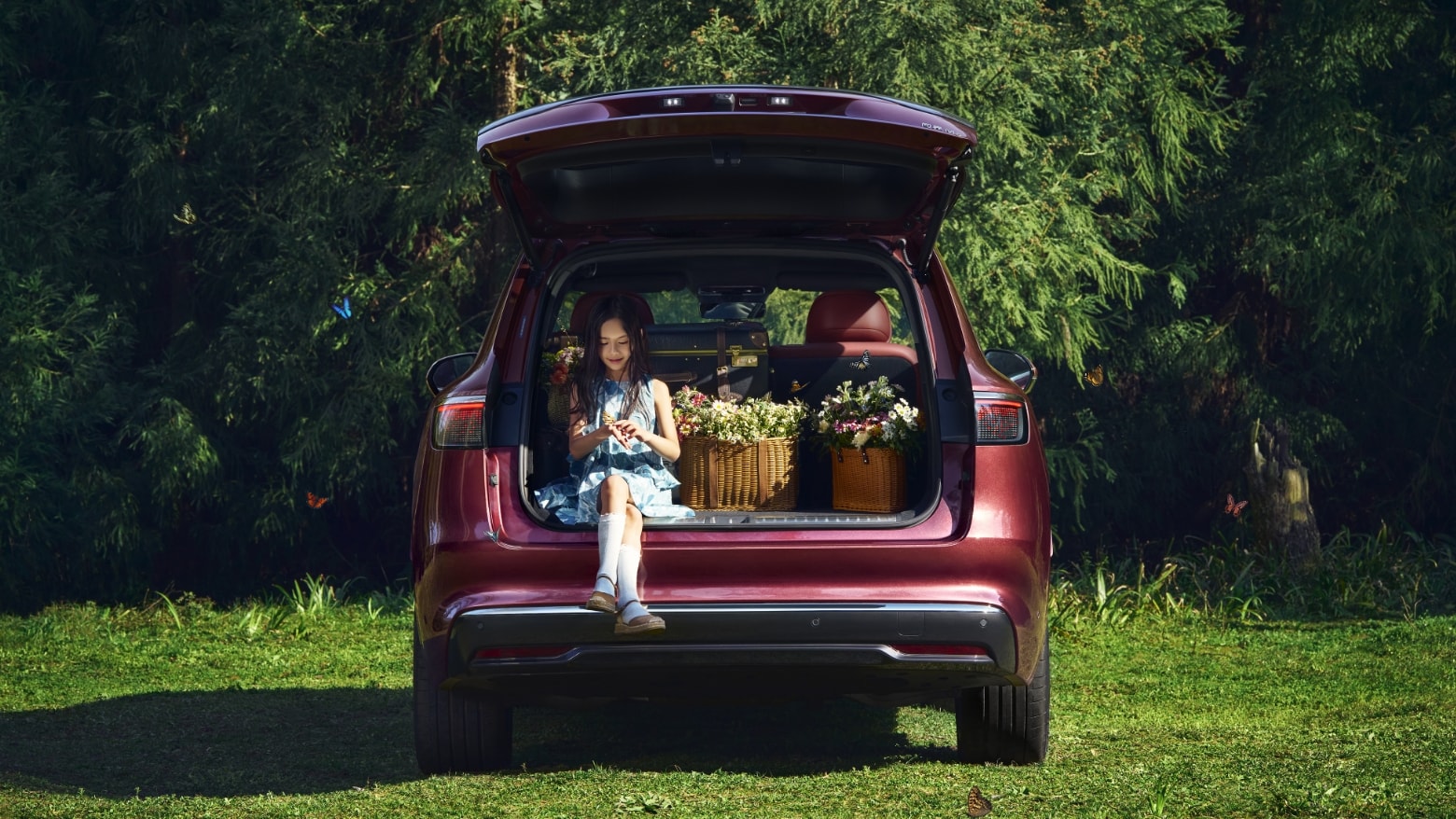 An AITO M8 in Galaxy with its 5-seat boot open, showing the model's open storage space