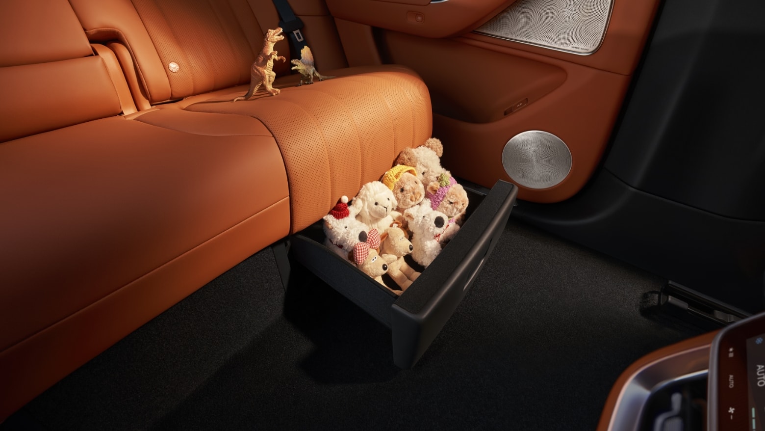 Showing the storage space under the second-row seats of the AITO M8 in Russet Orange