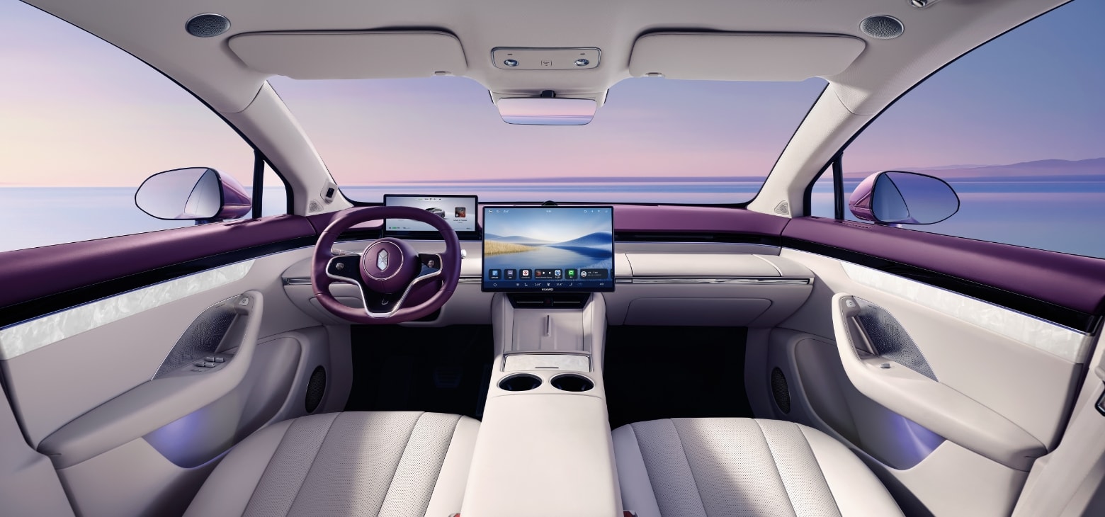Front space of the Luxeed R7, showing the driver's olive-shaped steering wheel, navigation screen, and Roland Purple interior
